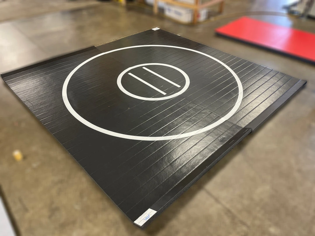 AK Athletic Equipment 10' x 10' Roll-Up Wrestling Mat - Black with White Circles | Martial Arts Clearance 1 AK Athletic Equipment Martial Arts Clearance 10' X 10' X 1 3/8" Roll-Up Wrestling Mat Black With White Circles - Indentation